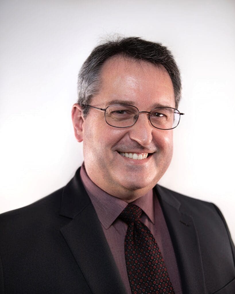Headshot of Dr Josh Briley smiling