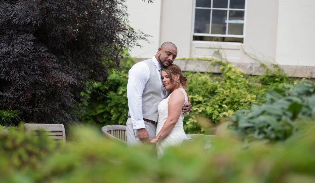 Picture of Grace Anderson and her husband embracing in the garden