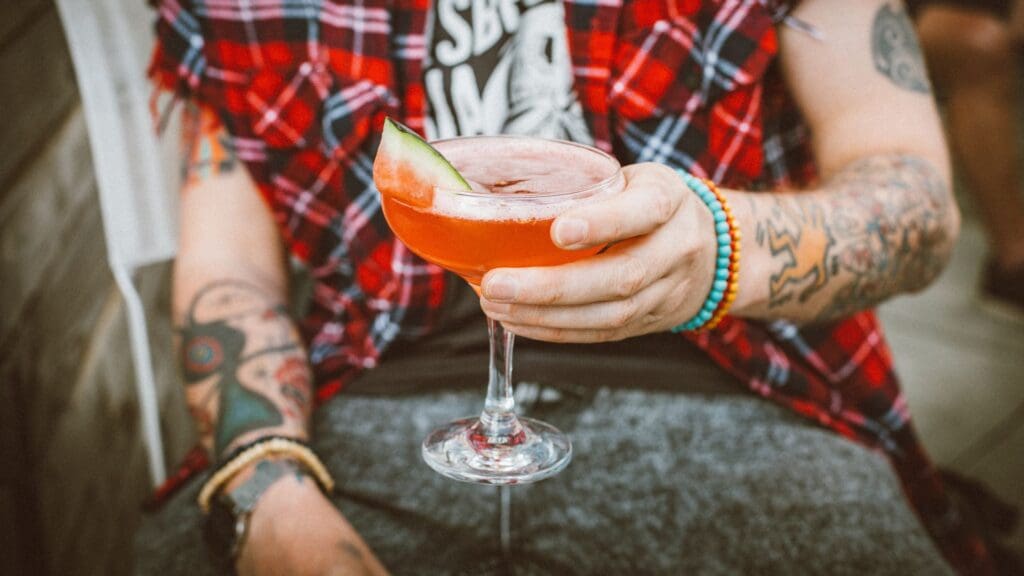 person holding a club soda mocktail