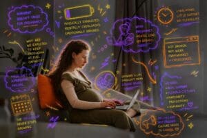 Pregnant woman sitting on couch working on her laptop